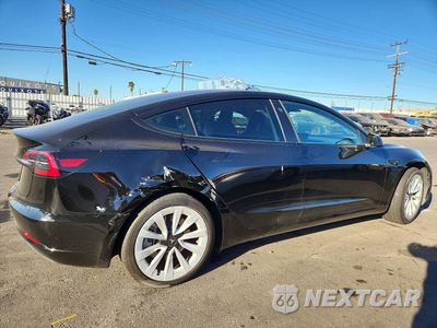 Trzecie zdjęcie samochodu z tyłu: 2023 TESLA MODEL 3 VIN:5YJ3E1EA1PF650344 - miniatura