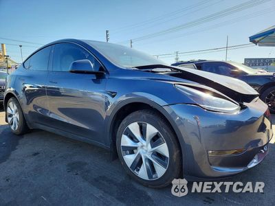 Czwarte zdjęcie samochodu z boku: 2023 TESLA MODEL Y VIN:7SAYGDED3PF940289 - miniatura