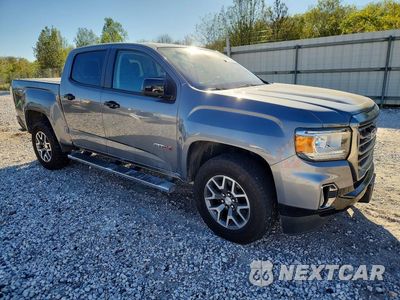 Czwarte zdjęcie samochodu z boku: 2022 GMC CANYON AT4 VIN:1GTG6FEN6N1176198 - miniatura