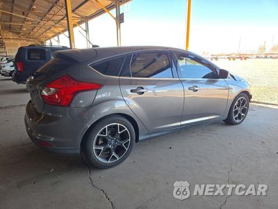 Trzecie zdjęcie samochodu z tyłu: 2012 FORD FOCUS TITANIUM VIN:1FAHP3N24CL378860 - miniatura