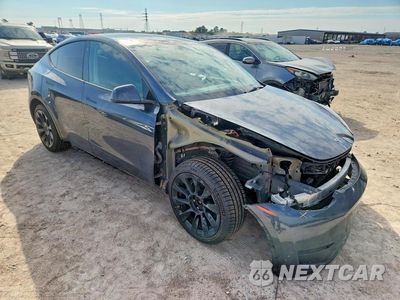 Czwarte zdjęcie samochodu z boku: 2023 TESLA MODEL Y VIN:7SAYGDEE1PA031232 - miniatura