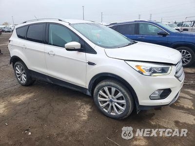 Czwarte zdjęcie samochodu z boku: 2017 FORD ESCAPE TITANIUM VIN:1FMCU9J95HUD09417 - miniatura