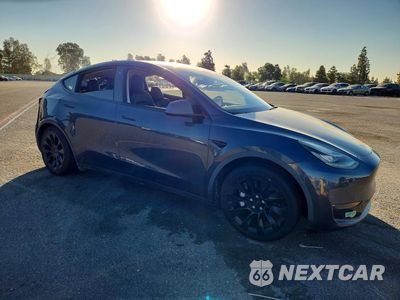 Czwarte zdjęcie samochodu z boku: 2022 TESLA MODEL Y VIN:7SAYGDEE3NF371935 - miniatura