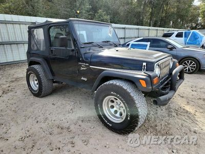 Czwarte zdjęcie samochodu z boku: 1999 JEEP WRANGLER / TJ SPORT VIN:1J4FY19S4XP401575 - miniatura