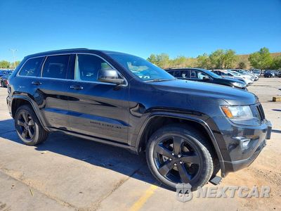 Czwarte zdjęcie samochodu z boku: 2015 JEEP GRAND CHEROKEE LAREDO VIN:1C4RJFAG2FC212635 - miniatura