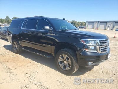 Czwarte zdjęcie samochodu z boku: 2018 CHEVROLET SUBURBAN K1500 LT VIN:1GNSKHKC2JR138474 - miniatura