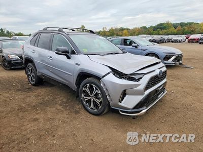 Czwarte zdjęcie samochodu z boku: 2024 TOYOTA RAV4 PRIME XSE VIN:JTMFB3FV0RD212654 - miniatura