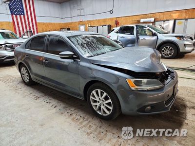 Czwarte zdjęcie samochodu z boku: 2014 VOLKSWAGEN JETTA SE VIN:3VWD17AJXEM372090 - miniatura