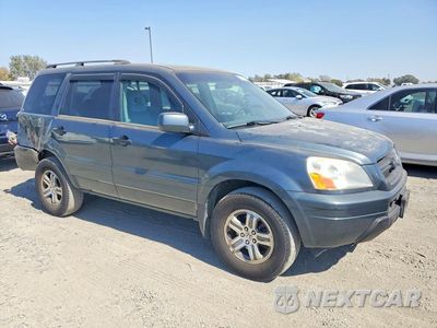 Czwarte zdjęcie samochodu z boku: 2004 HONDA PILOT EXL VIN:5FNYF18624B010472 - miniatura