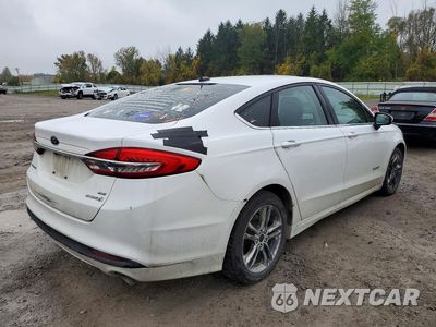 Trzecie zdjęcie samochodu z tyłu: 2018 FORD FUSION SE HYBRID VIN:3FA6P0LU1JR249144 - miniatura