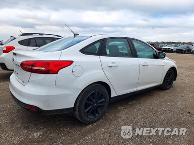 Trzecie zdjęcie samochodu z tyłu: 2018 FORD FOCUS SE VIN:1FADP3F27JL327721 - miniatura
