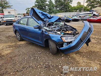 Czwarte zdjęcie samochodu z boku: 2017 VOLKSWAGEN JETTA SE VIN:3VWB67AJ1HM338343 - miniatura