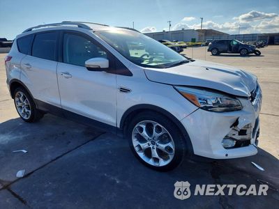Czwarte zdjęcie samochodu z boku: 2014 FORD ESCAPE TITANIUM VIN:1FMCU0J95EUA11229 - miniatura