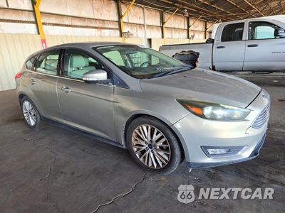 Czwarte zdjęcie samochodu z boku: 2016 FORD FOCUS TITANIUM VIN:1FADP3N26GL307826 - miniatura