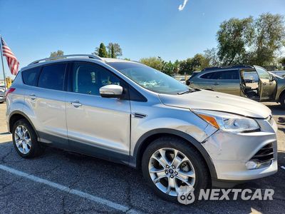 Czwarte zdjęcie samochodu z boku: 2015 FORD ESCAPE TITANIUM VIN:1FMCU0J9XFUA25631 - miniatura