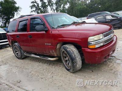 Czwarte zdjęcie samochodu z boku: 2002 CHEVROLET TAHOE C1500 VIN:1GNEC13Z32R186359 - miniatura