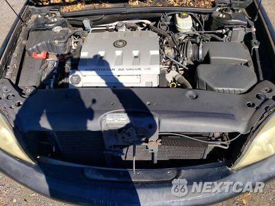 Zdjęcie 12 z 13 samochodu: 2003 CADILLAC DEVILLE VIN:1GEEH00Y03U500894 - miniatura