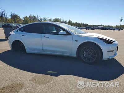Czwarte zdjęcie samochodu z boku: 2021 TESLA MODEL 3 VIN:5YJ3E1EA4MF988977 - miniatura
