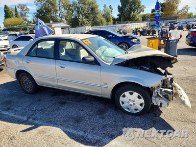 Czwarte zdjęcie samochodu z boku: 2001 MAZDA PROTEGE LX VIN:JM1BJ225110422483 - miniatura