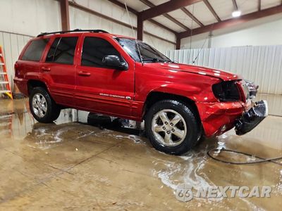 Czwarte zdjęcie samochodu z boku: 2003 JEEP GRAND CHEROKEE OVERLAND VIN:1J8GW68J53C573131 - miniatura
