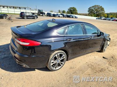 Trzecie zdjęcie samochodu z tyłu: 2020 FORD FUSION TITANIUM VIN:3FA6P0D97LR115977 - miniatura