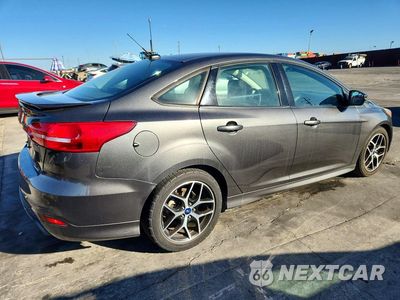 Trzecie zdjęcie samochodu z tyłu: 2016 FORD FOCUS SE VIN:1FADP3F25GL357731 - miniatura