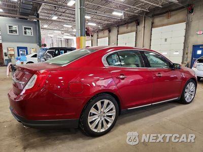 Trzecie zdjęcie samochodu z tyłu: 2016 LINCOLN MKS VIN:1LNHL9FT4GG602655 - miniatura