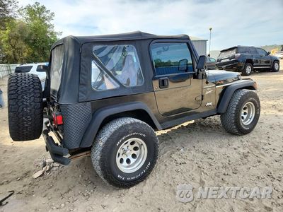 Trzecie zdjęcie samochodu z tyłu: 1999 JEEP WRANGLER / TJ SPORT VIN:1J4FY19S4XP401575 - miniatura