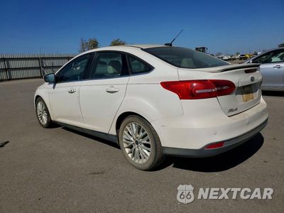 Drugie zdjęcie samochodu z przodu: 2017 FORD FOCUS TITANIUM VIN:1FADP3J22HL260740 - miniatura