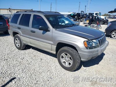 Czwarte zdjęcie samochodu z boku: 1999 JEEP GRAND CHEROKEE LAREDO VIN:1J4GW58S4XC600250 - miniatura