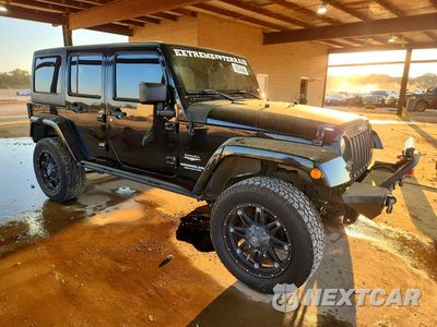Czwarte zdjęcie samochodu z boku: 2013 JEEP WRANGLER UNLIMITED SAHARA VIN:1C4HJWEG6DL627217 - miniatura