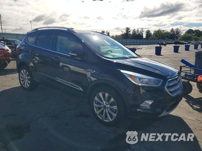 Czwarte zdjęcie samochodu z boku: 2017 FORD ESCAPE TITANIUM VIN:1FMCU9J98HUE43855 - miniatura
