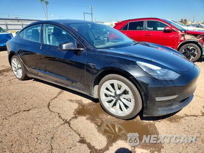 Czwarte zdjęcie samochodu z boku: 2022 TESLA MODEL 3 VIN:5YJ3E1EB4NF288970 - miniatura