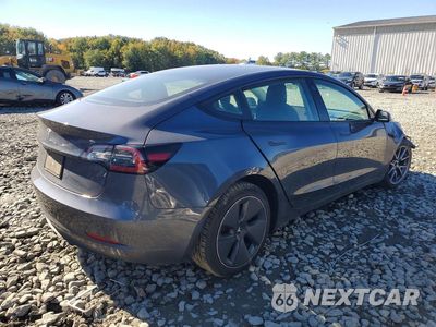 Trzecie zdjęcie samochodu z tyłu: 2022 TESLA MODEL 3 VIN:5YJ3E1EA7NF329051 - miniatura