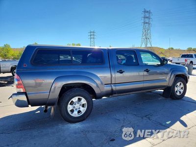 Trzecie zdjęcie samochodu z tyłu: 2014 TOYOTA TACOMA DOUBLE CAB LONG BED VIN:3TMMU4FN4EM069214 - miniatura