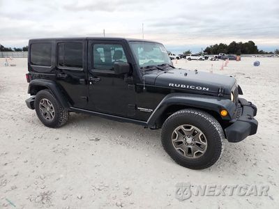 Czwarte zdjęcie samochodu z boku: 2016 JEEP WRANGLER UNLIMITED RUBICON VIN:1C4BJWFG2GL229169 - miniatura