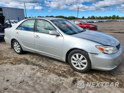 Czwarte zdjęcie samochodu z boku: 2002 TOYOTA CAMRY XLE V6 VIN:4T1BF30K42U507274 - miniatura