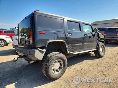Trzecie zdjęcie samochodu z tyłu: 2004 HUMMER H2 VIN:5GRGN23U04H114421 - miniatura