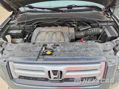 Zdjęcie 12 z 14 samochodu: 2006 HONDA PILOT EX VIN:2HKYF18576H544112 - miniatura