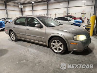 Czwarte zdjęcie samochodu z boku: 2002 NISSAN MAXIMA GXE VIN:JN1DA31D32T430370 - miniatura