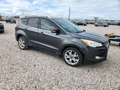 Czwarte zdjęcie samochodu z boku: 2016 FORD ESCAPE TITANIUM VIN:1FMCU0J92GUC78380 - miniatura
