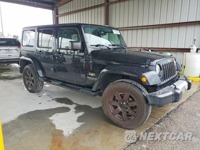 Czwarte zdjęcie samochodu z boku: 2015 JEEP WRANGLER UNLIMITED SAHARA VIN:1C4BJWEG8FL688786 - miniatura