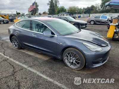 Czwarte zdjęcie samochodu z boku: 2018 TESLA MODEL 3 VIN:5YJ3E1EBXJF130790 - miniatura