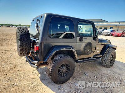 Trzecie zdjęcie samochodu z tyłu: 2004 JEEP WRANGLER / TJ SAHARA VIN:1J4FA59SX4P722575 - miniatura