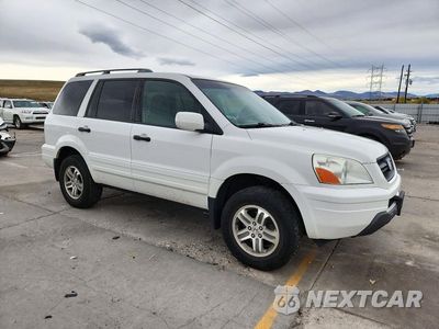 Czwarte zdjęcie samochodu z boku: 2004 HONDA PILOT EX VIN:2HKYF184X4H611502 - miniatura