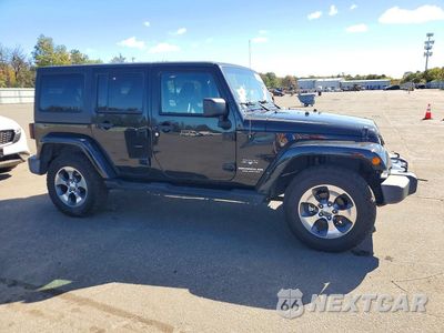 Czwarte zdjęcie samochodu z boku: 2016 JEEP WRANGLER UNLIMITED SAHARA VIN:1C4HJWEG8GL198649 - miniatura