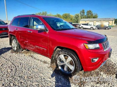 Czwarte zdjęcie samochodu z boku: 2014 JEEP GRAND CHEROKEE OVERLAND VIN:1C4RJFCG4EC133267 - miniatura