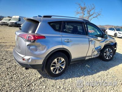 Trzecie zdjęcie samochodu z tyłu: 2018 TOYOTA RAV4 HYBRID XLE VIN:JTMRJREV2JD192206 - miniatura
