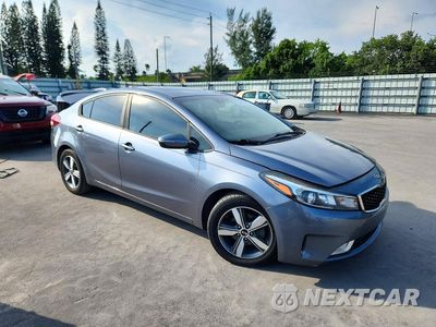 Czwarte zdjęcie samochodu z boku: 2018 KIA FORTE S VIN:3KPFL4A76JE200409 - miniatura