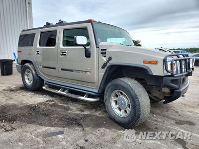 Czwarte zdjęcie samochodu z boku: 2003 HUMMER H2 VIN:5GRGN23U63H137636 - miniatura